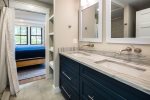Lower level full bathroom with dual sink and stand up shower